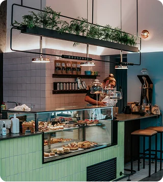 Bright cafe interior with a pastry counter